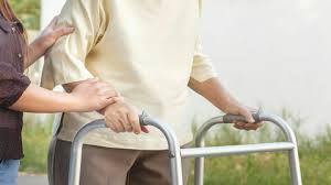 lady walking with wheel zimmer frame