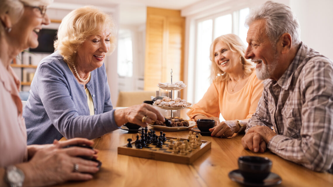 Elderly people playing board games