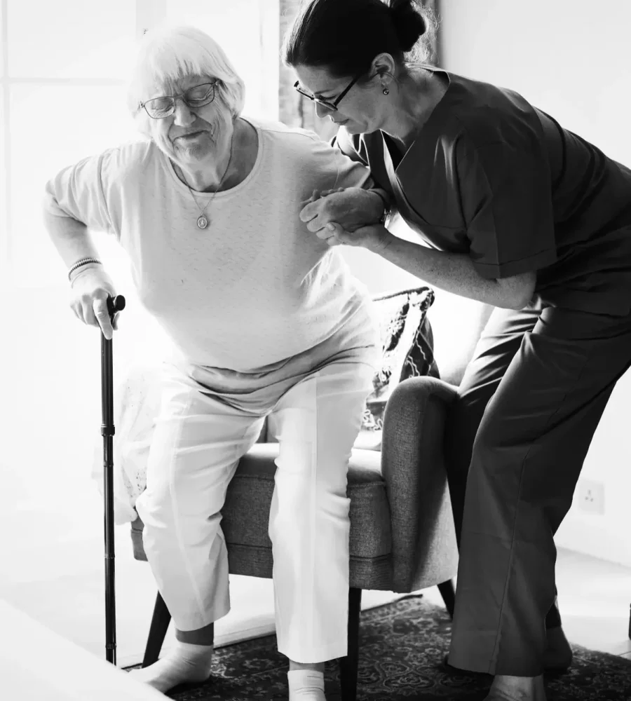 1.5 (1) Physiotherapist helping elderly patient -home-physiotherapy